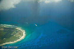 Dive boats heading out to the reefs near Little Cayman. by Don Bricker 